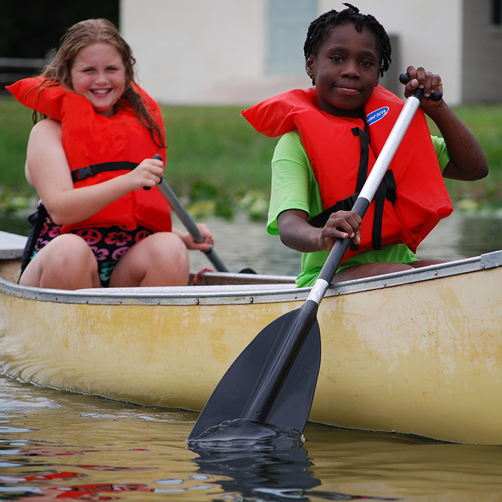 Two children canoeing