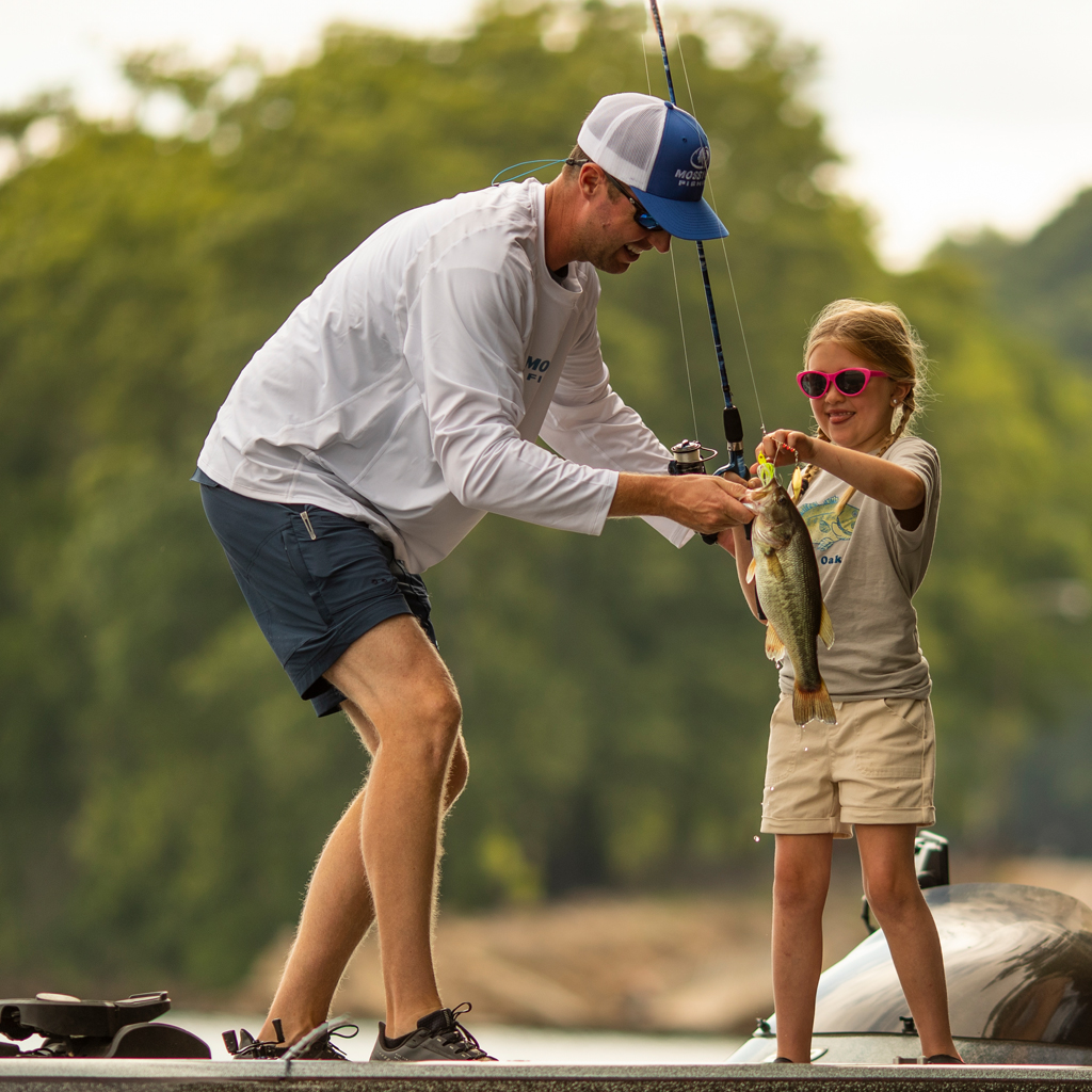 Teaching a young girl to fish