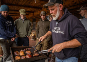 Man grilling waterfowl meat