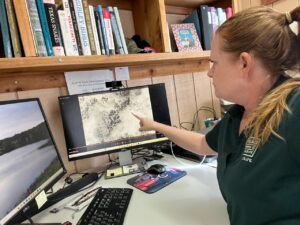 Wildlife Biologist Deanna Pfeffer points to a deer seen in a thermal video TPWD photo